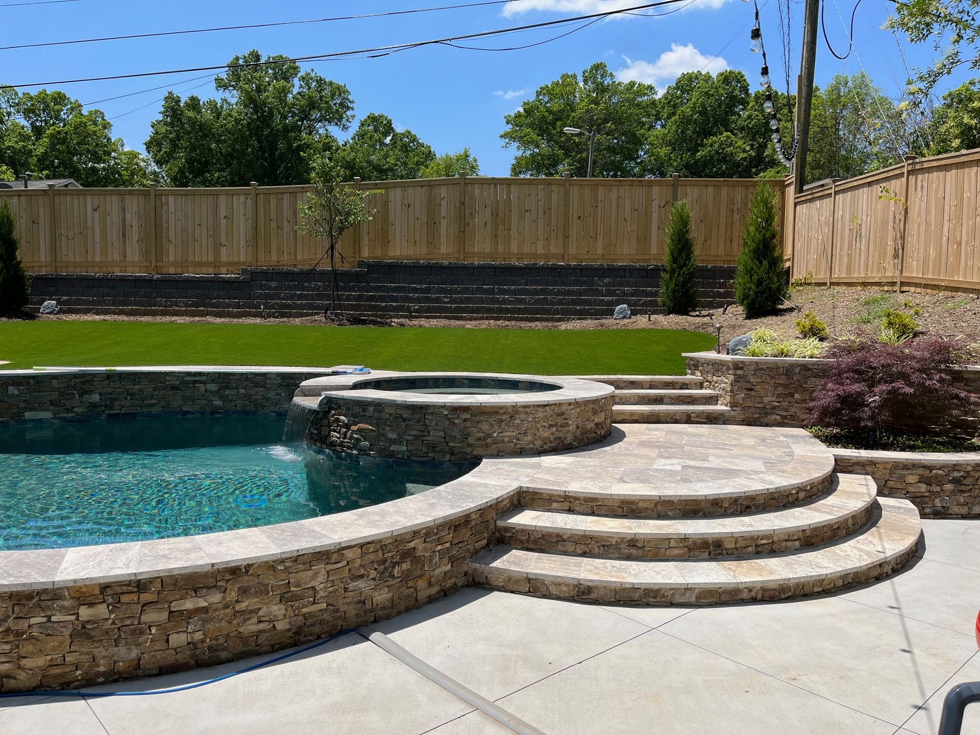 A large swimming pool with stairs leading up to it