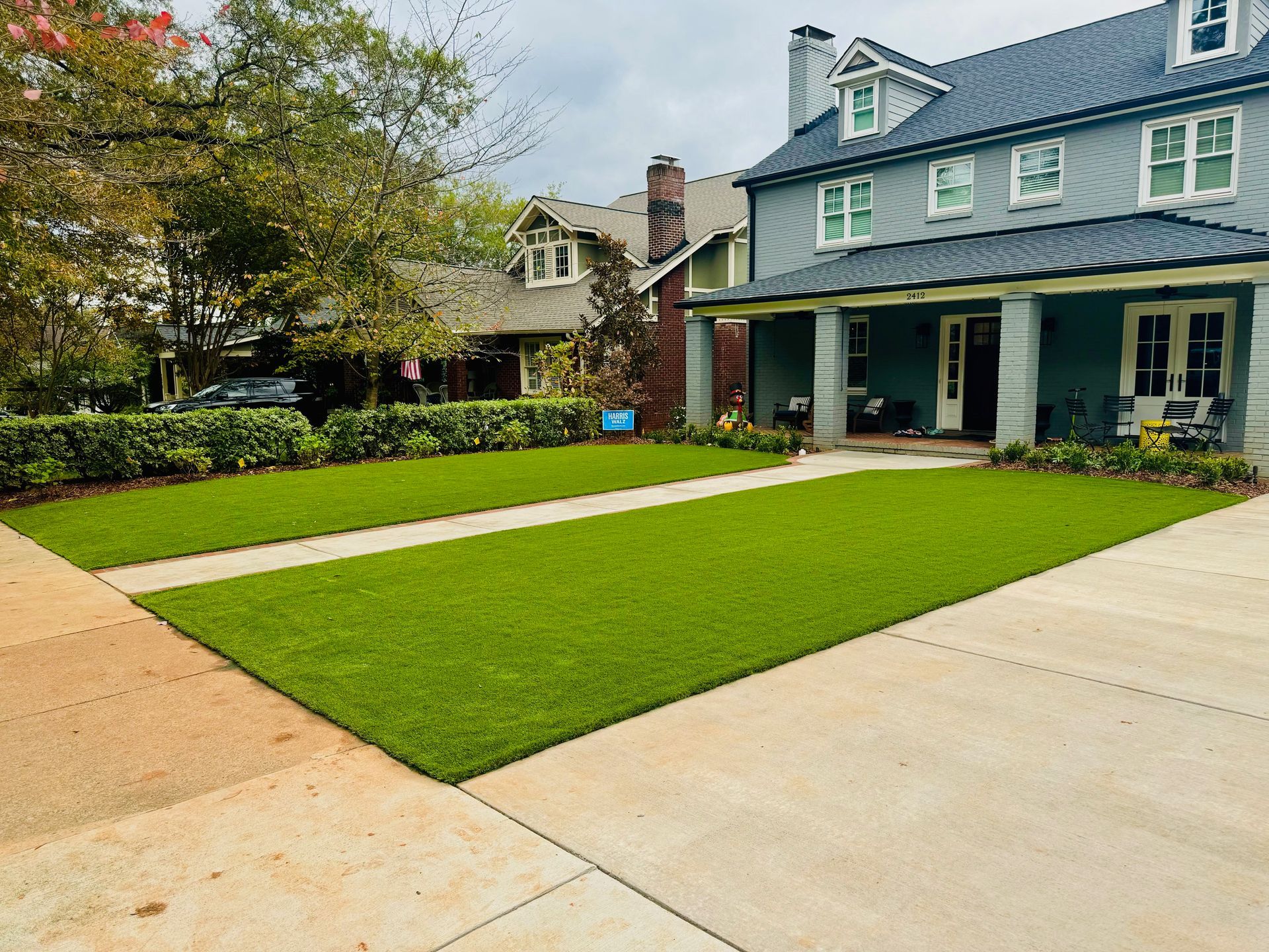 A large house with a large lawn in front of it