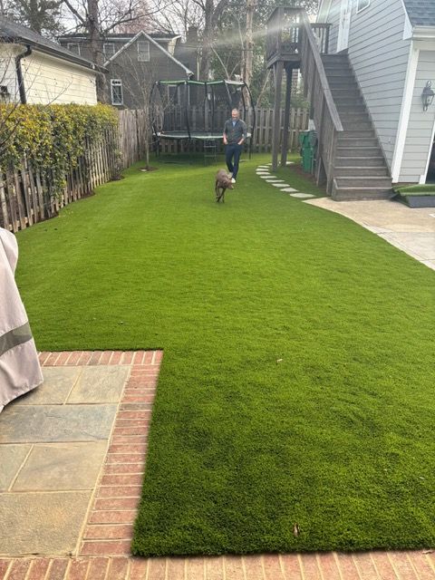 Man Walking With Dog | Matthews, NC | Artificial Turf Products