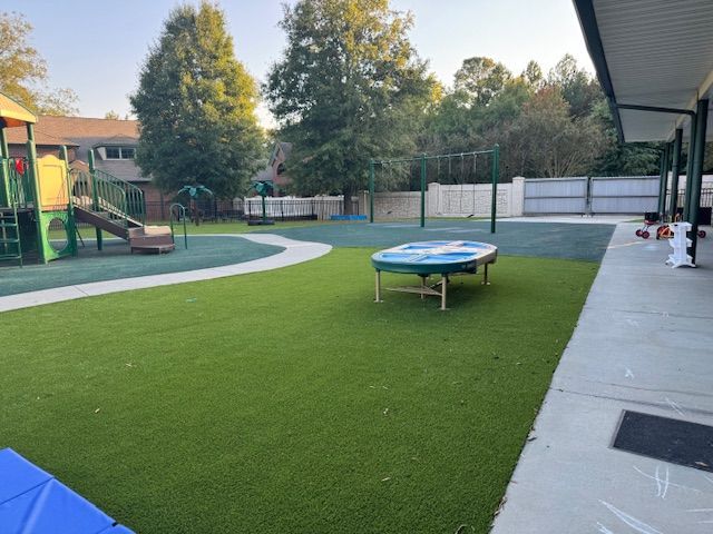 A playground with a table in the middle of it