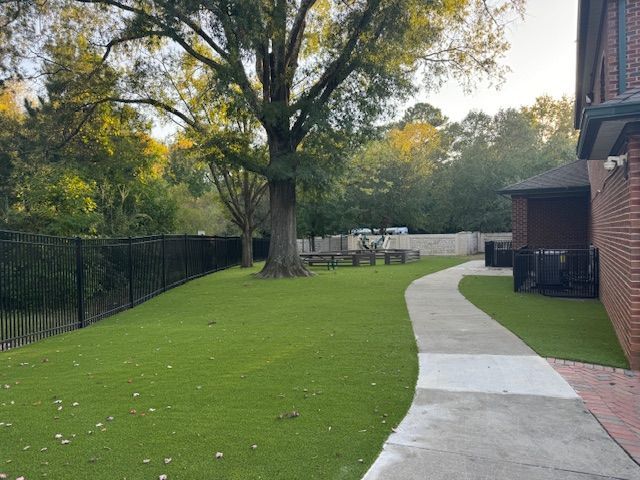 A brick building with a walkway leading to it