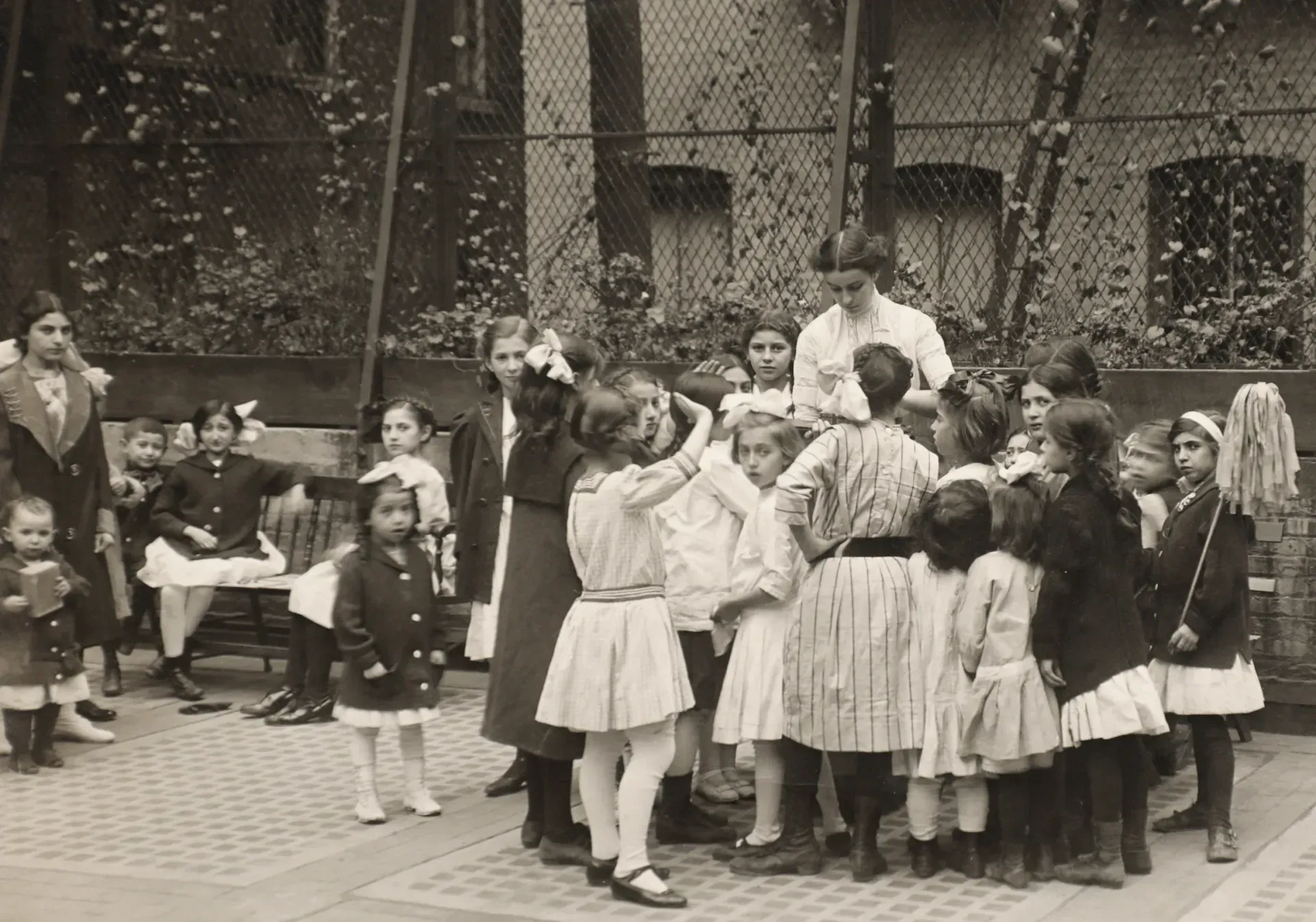 A black and white photo of a group of children playing