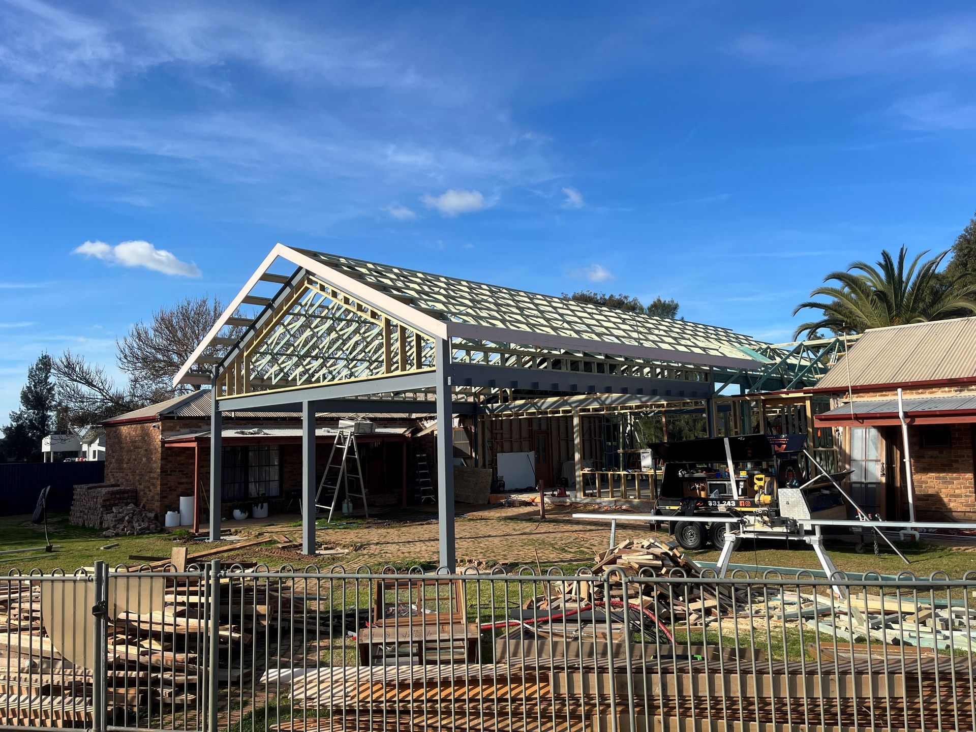 Construction site with a steel-framed roof. 