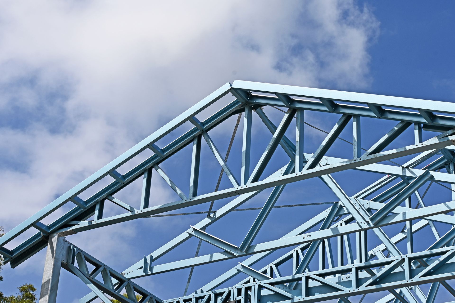 Close-up of metal preframed roof trusses for a house during construction.