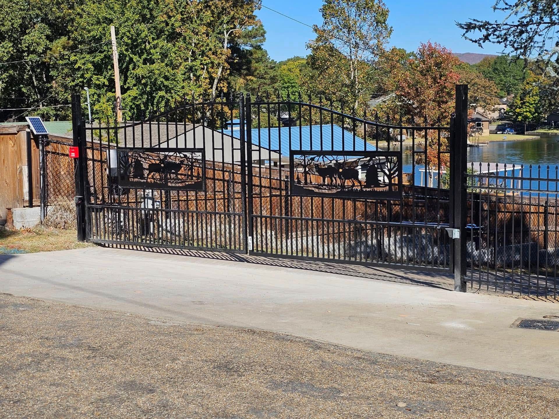 A wrought iron gate with a picture of a horse on it