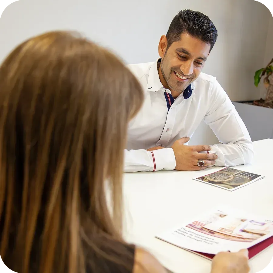 Reza Hooda discussing accounting services with a client