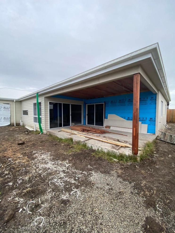 A House Is Being Built in The Middle of A Dirt Field — Formosa Building And Renovations in Kensington, QLD