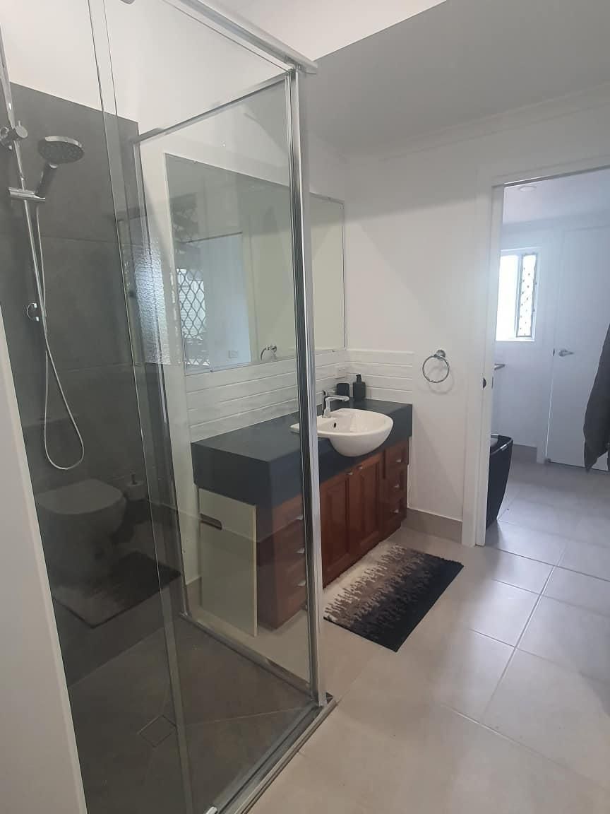 A Bathroom with A Sink, Toilet and Shower — Formosa Building And Renovations in Baffle Creek, QLD
