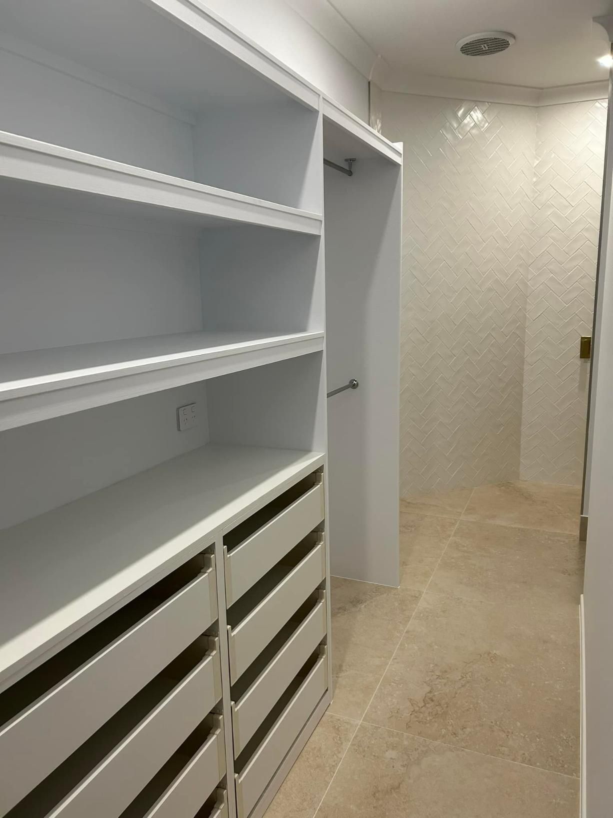 A Walk in Closet with Lots of Shelves and Drawers — Formosa Building And Renovations in Woodgate, QLD