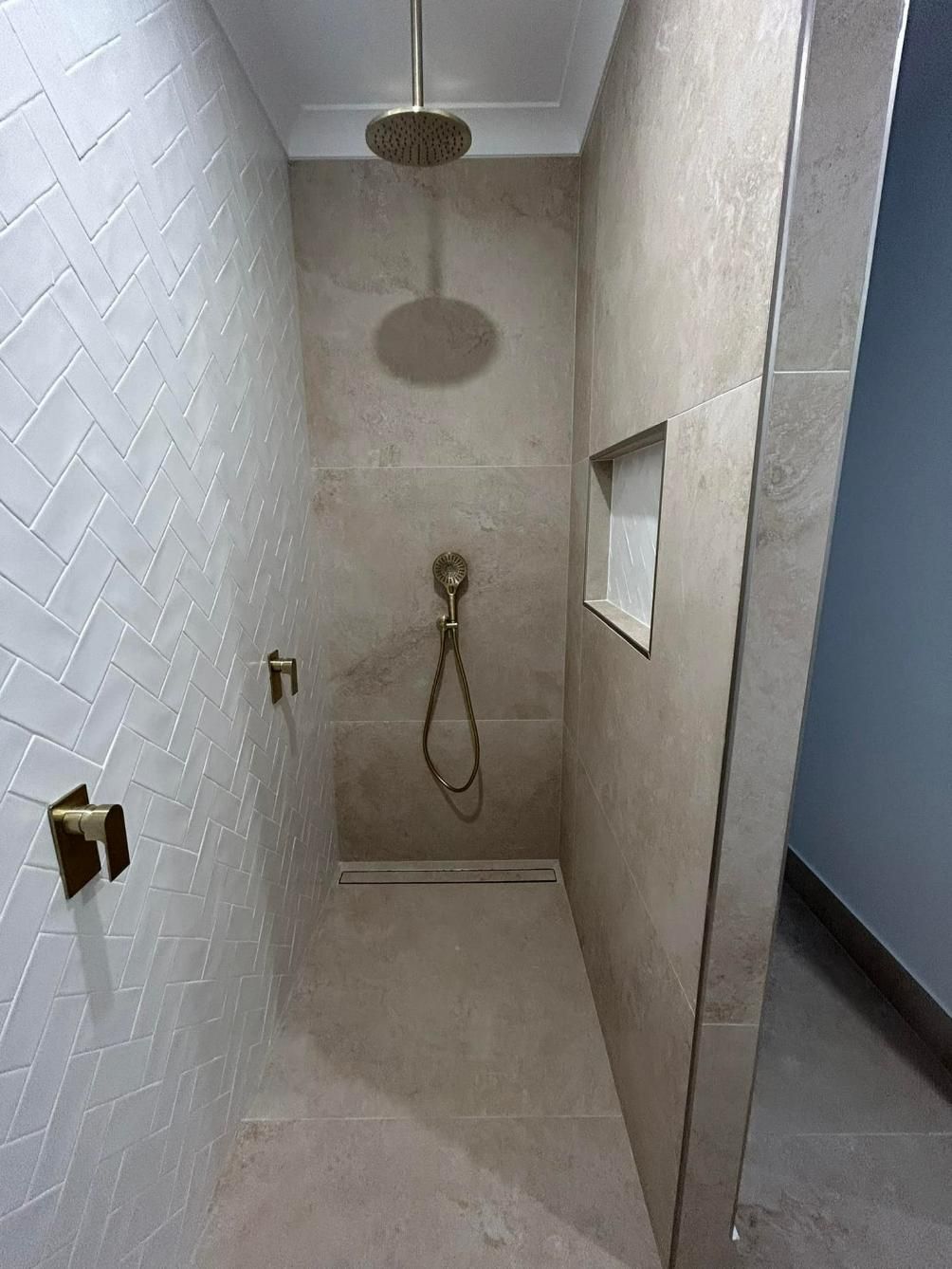 A Bathroom with A Walk in Shower and A Shower Head — Formosa Building And Renovations in Bargara, QLD