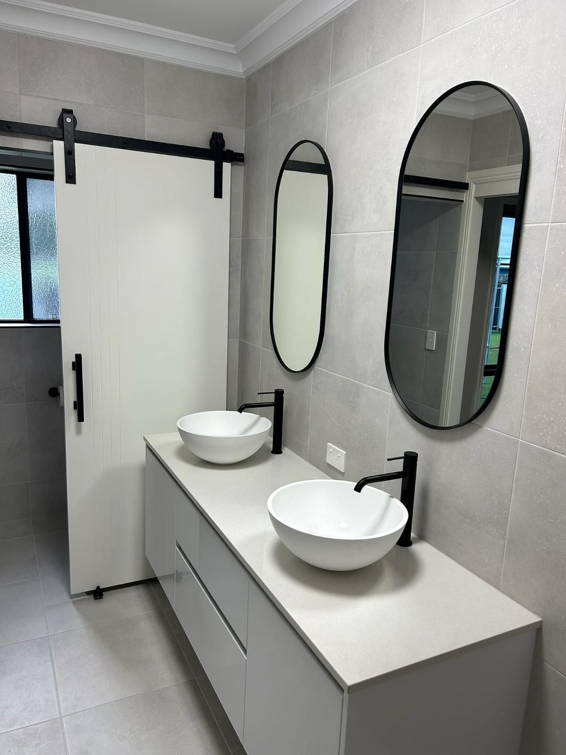A Bathroom with Two Sinks and Two Mirrors — Formosa Building And Renovations in Gin Gin, QLD