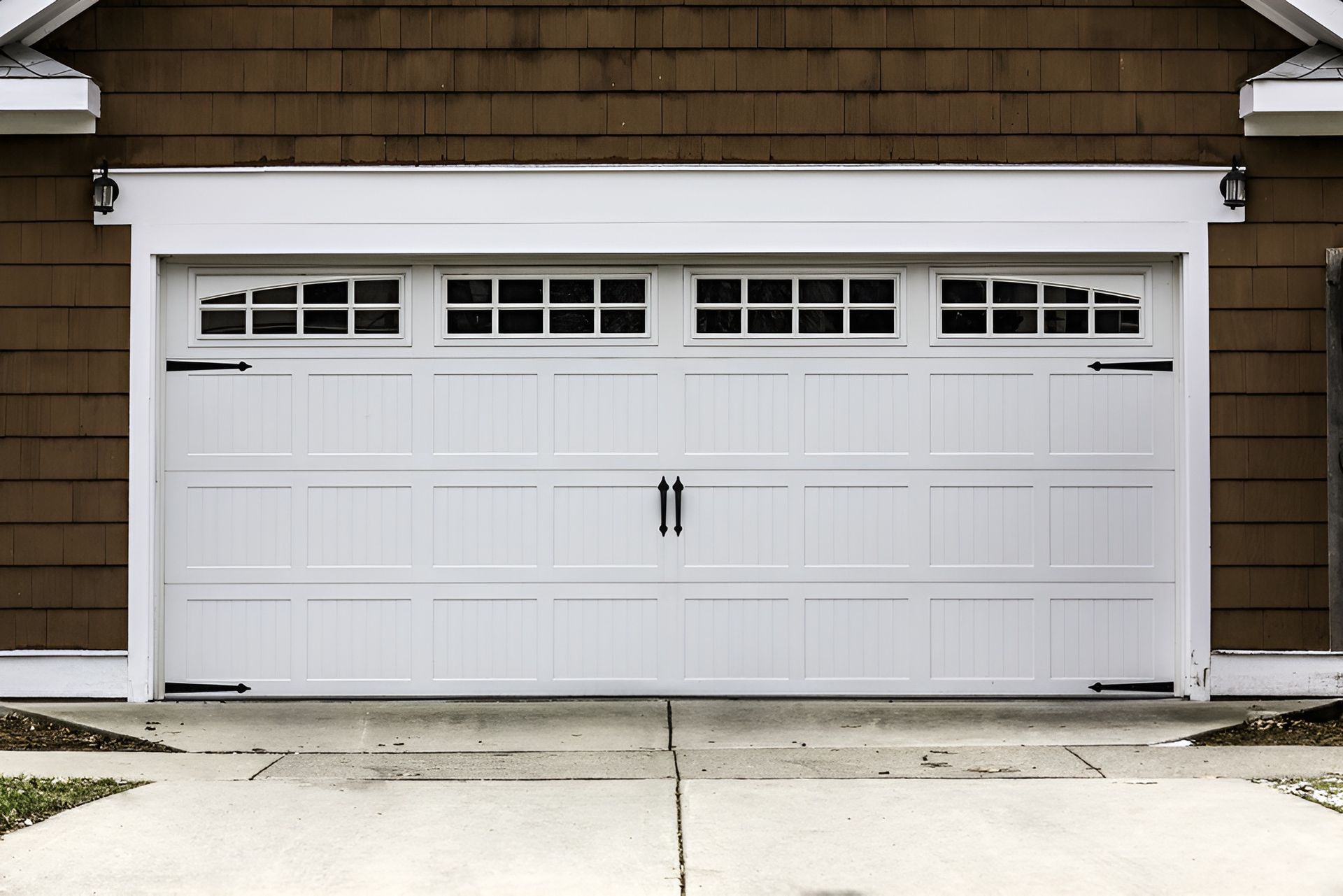 White Garage Door With Decorative Windows and Hardware — Duncan's Doors In Gatton, QLD