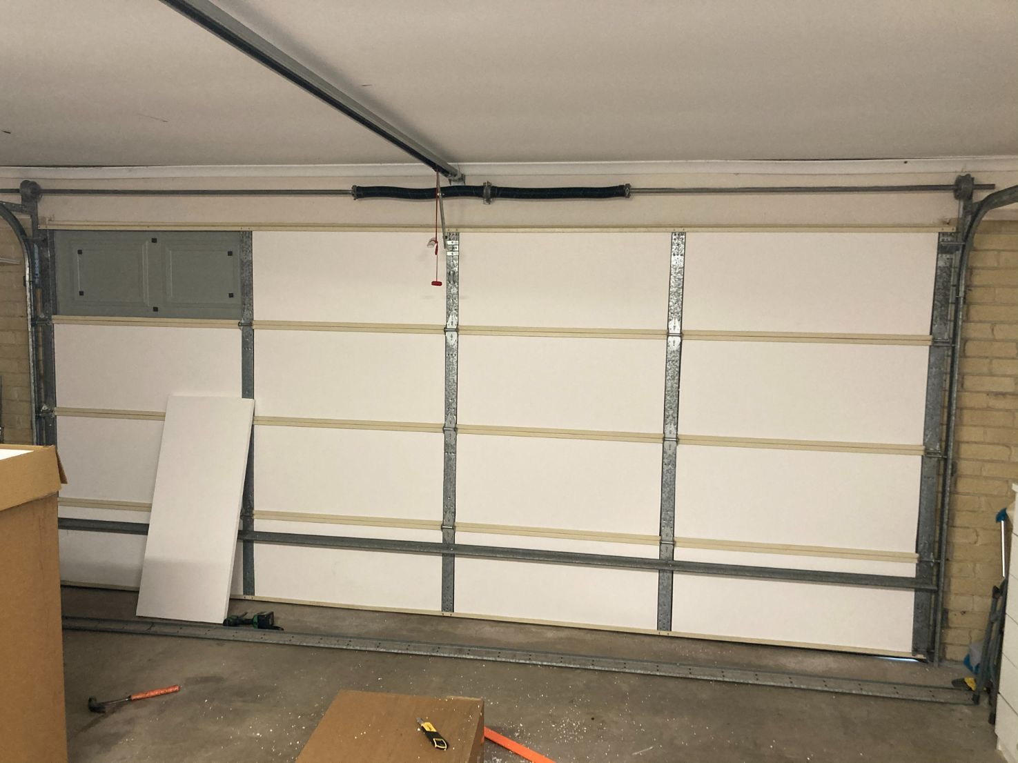 Garage Door With White Insulation Panels Installed on the Inside — Duncan's Doors In Oakey, QLD