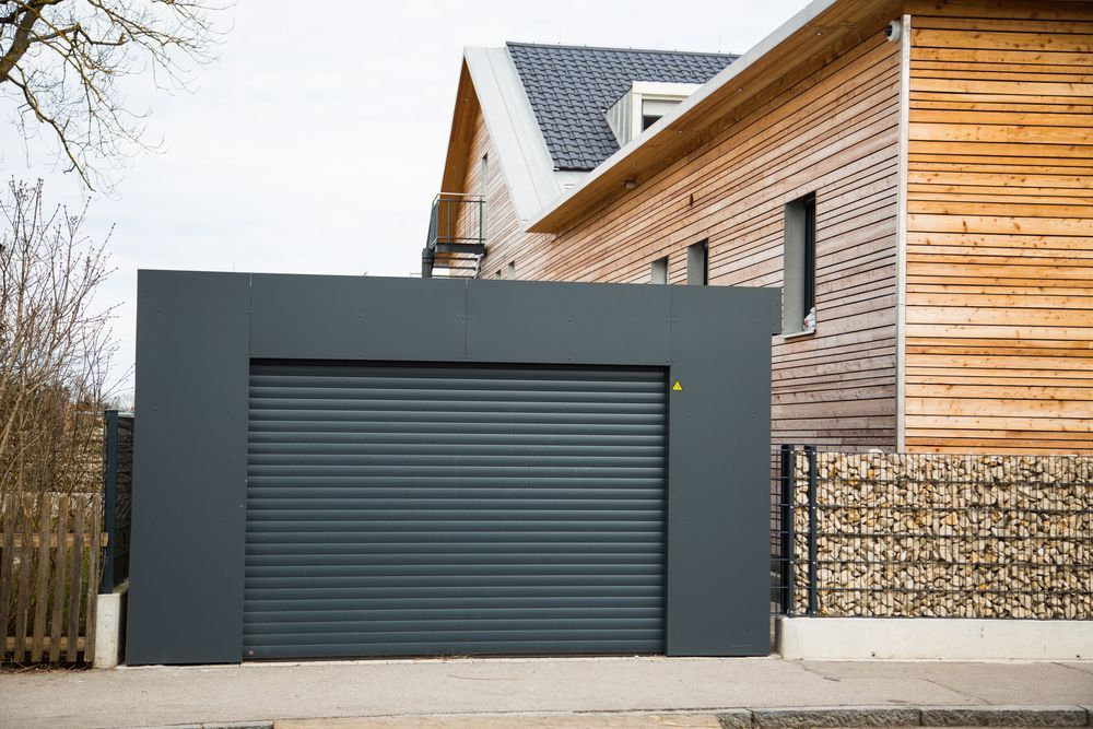 Modern Gray Garage With a Roller Door — Duncan's Doors In Warwick, QLD
