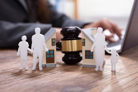 Gavel Between Split Family Figures And House Model — White Cloud, MI — Cheryl Sterling Attorney At Law