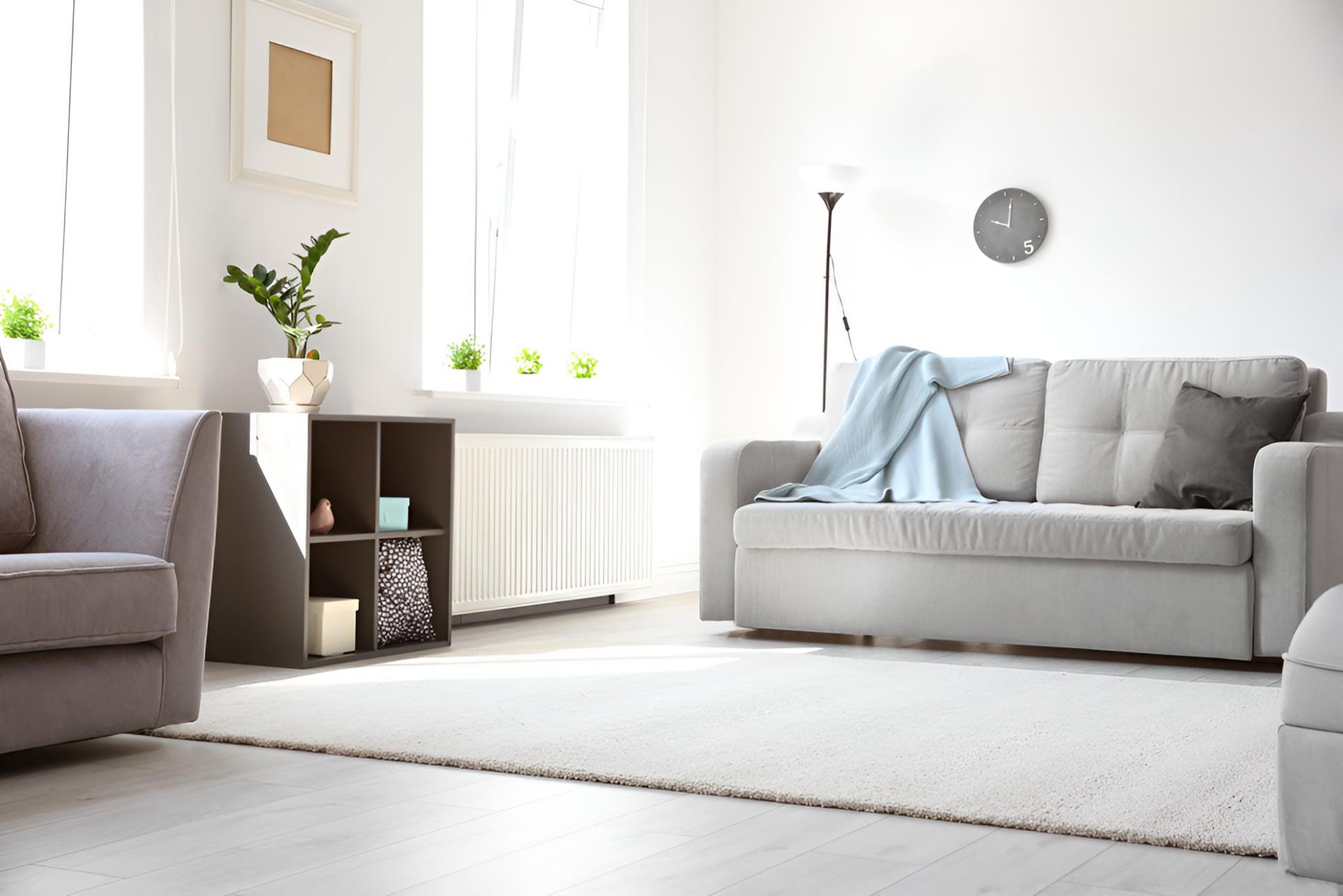 Living Room With a Couch, Chair, and Rug — Affordable Carpets & Mats in Caboolture, QLD