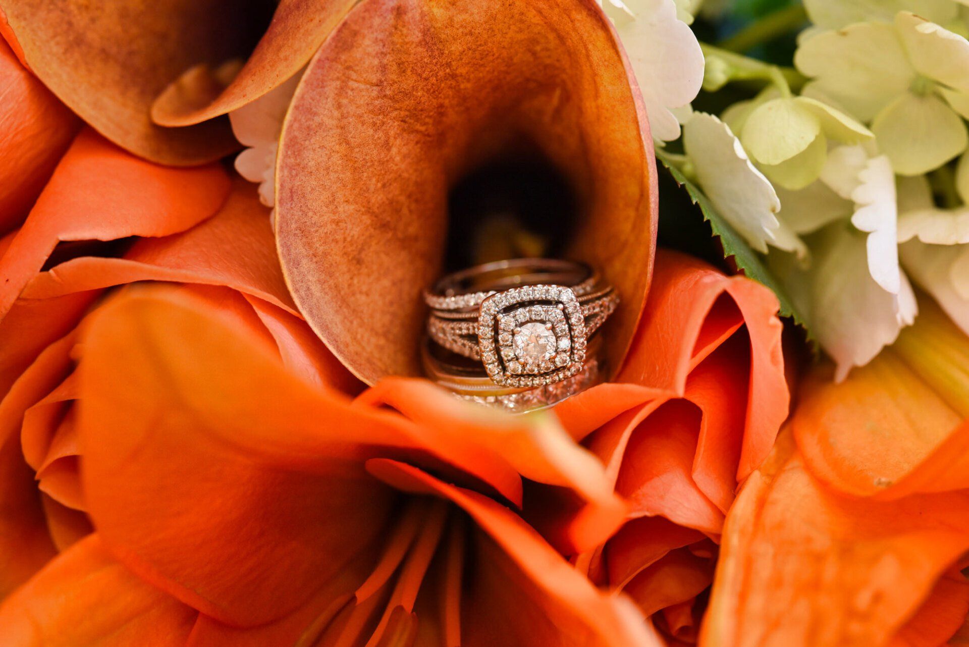 a close up of a wedding ring in a flower .