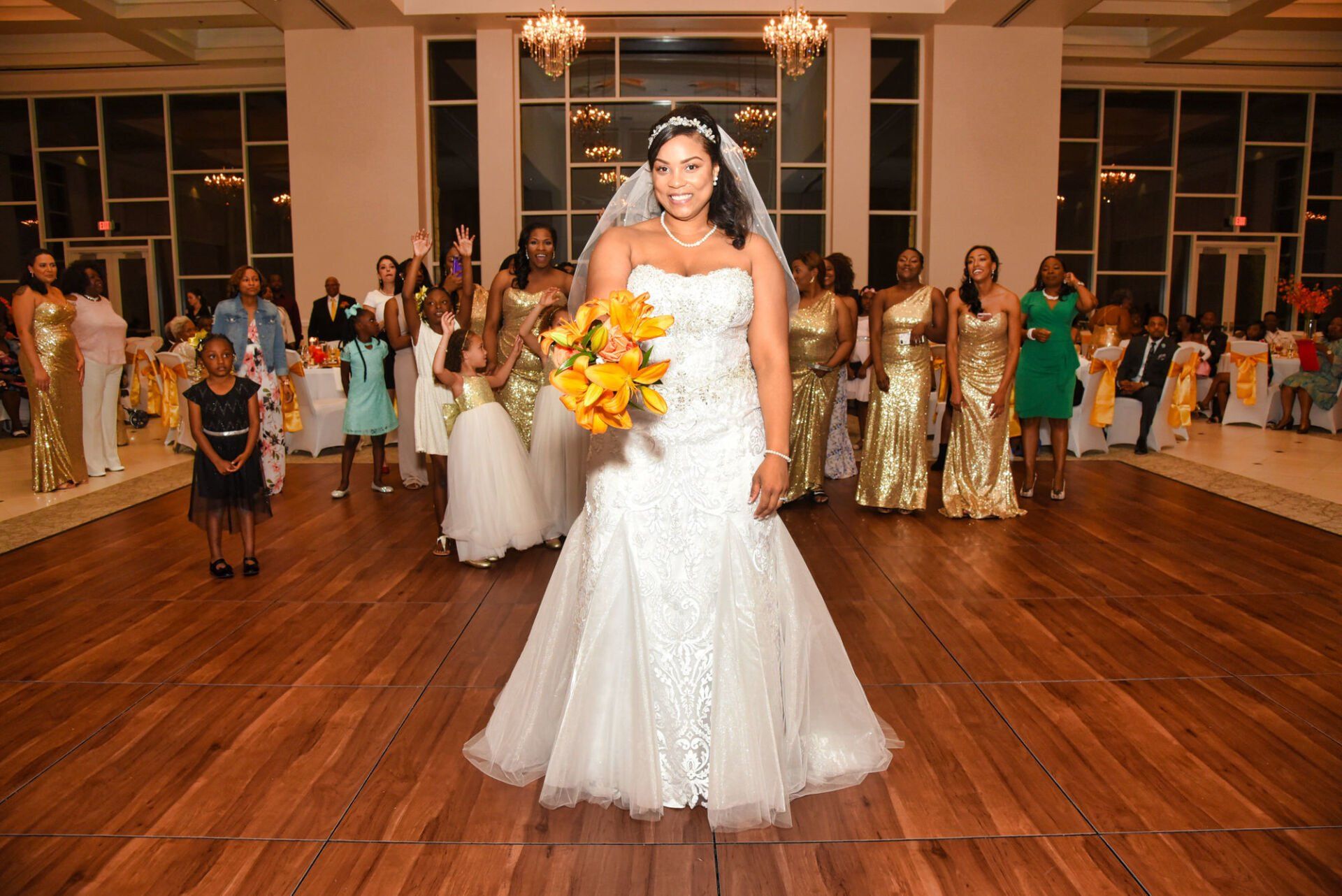 a bride in a wedding dress is holding a bouquet of flowers