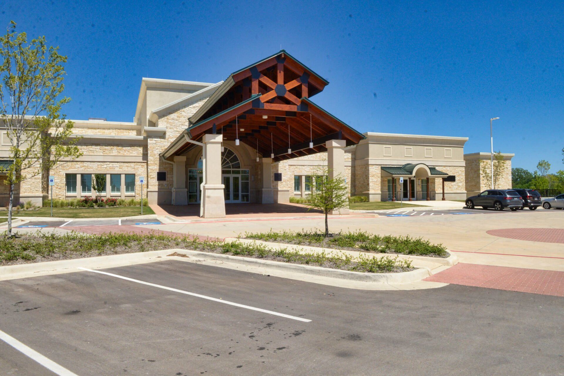 a large building with a parking lot in front of it