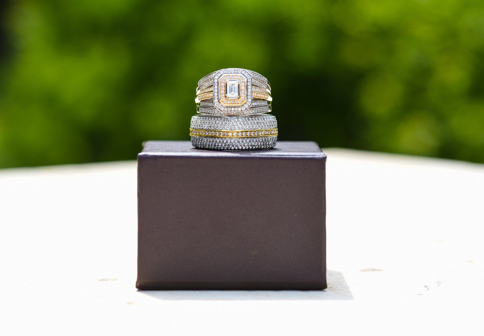 a couple of rings are stacked on top of each other on a box .