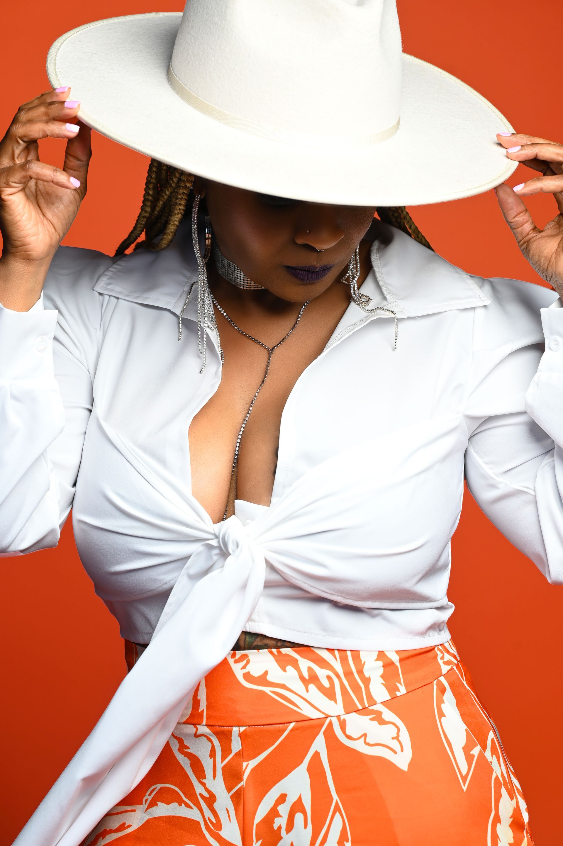 a woman wearing a white hat and a white shirt