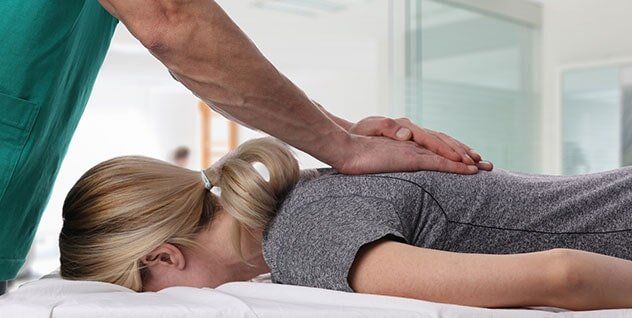 Woman Having Chiropractic Back Adjustment - Chiropractic Services in Anderson, SC