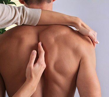 Therapist Checking Shoulder Mobility - Chiropractic Services in Anderson, SC