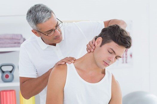 Doctor Doing Neck Adjustment - Chiropractic Services in Anderson, SC