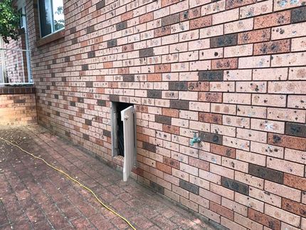 brick wall with white hatch