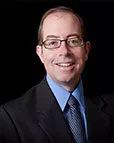 Scott E. Phillips, M.D., FACS, FAAOA