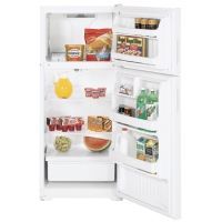 A white refrigerator with the door open and filled with food.