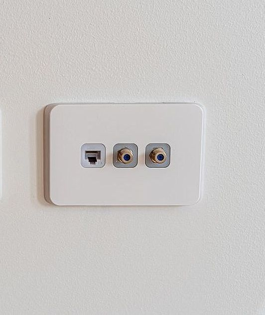 One White Television Outlet On A  White Wall — Craig's TV/Antenna Services In Maryland, NSW