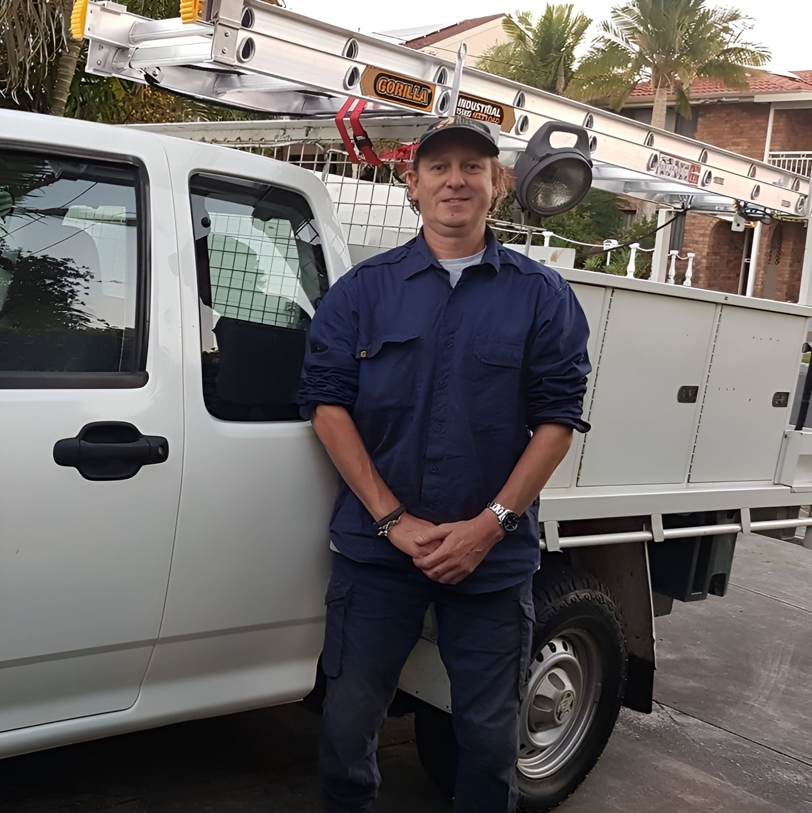 A Man Is Standing In Front Of A White Truck That Says Corsa — Craig's TV/Antenna Services In Maryland, NSW