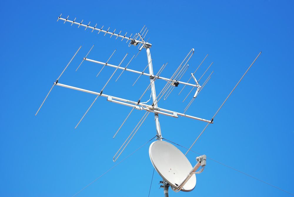A Large Antenna And Satellite Dish Against A Blue Sky —  Craig's TV/Antenna Services In Maitland, NSW