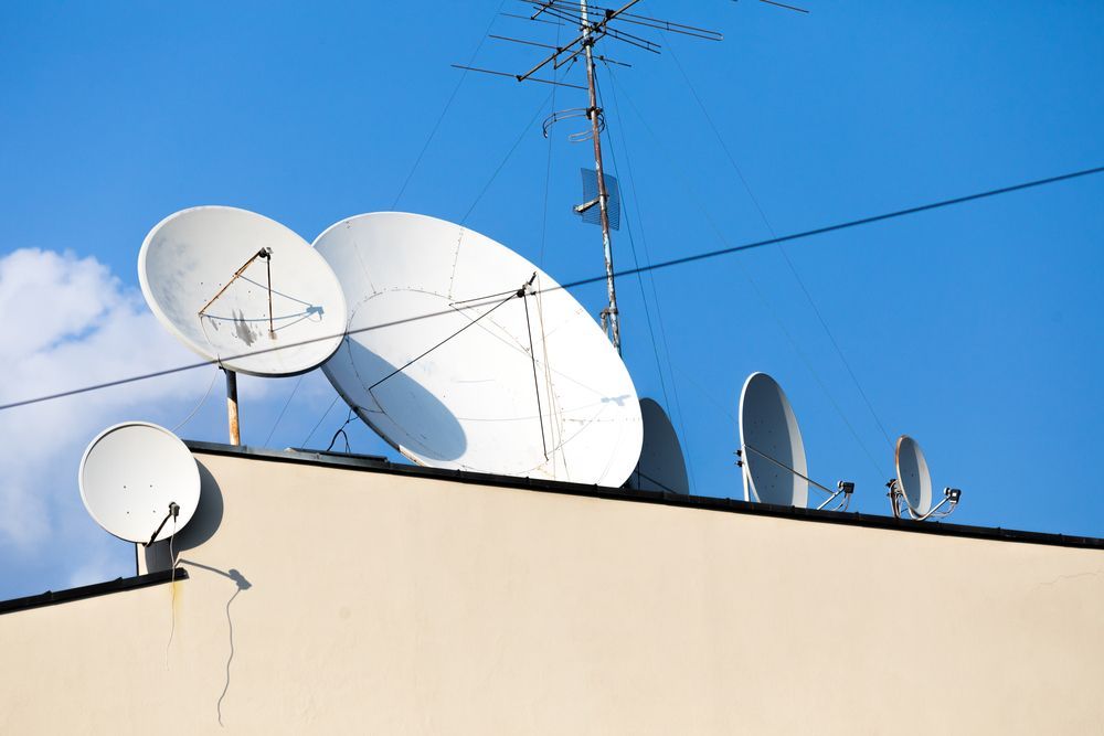 A Bunch Of Satellite Dishes On Top Of A Building —  Craig's TV/Antenna Services In Merewether, NSW
