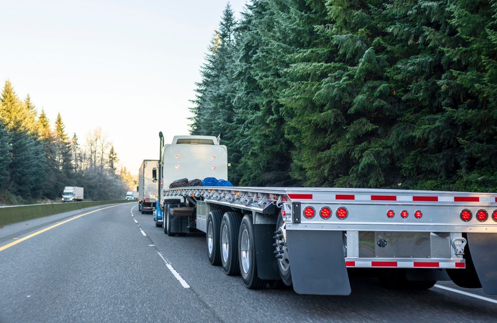 A Semi-Truck with A Flatbed Trailer — Aust. Advanced Trailer Sales & Service in Berrimah, NT