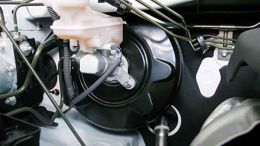 A Car Engine Bay with Brake Booster — Aust. Advanced Trailer Sales & Service in Berrimah, NT