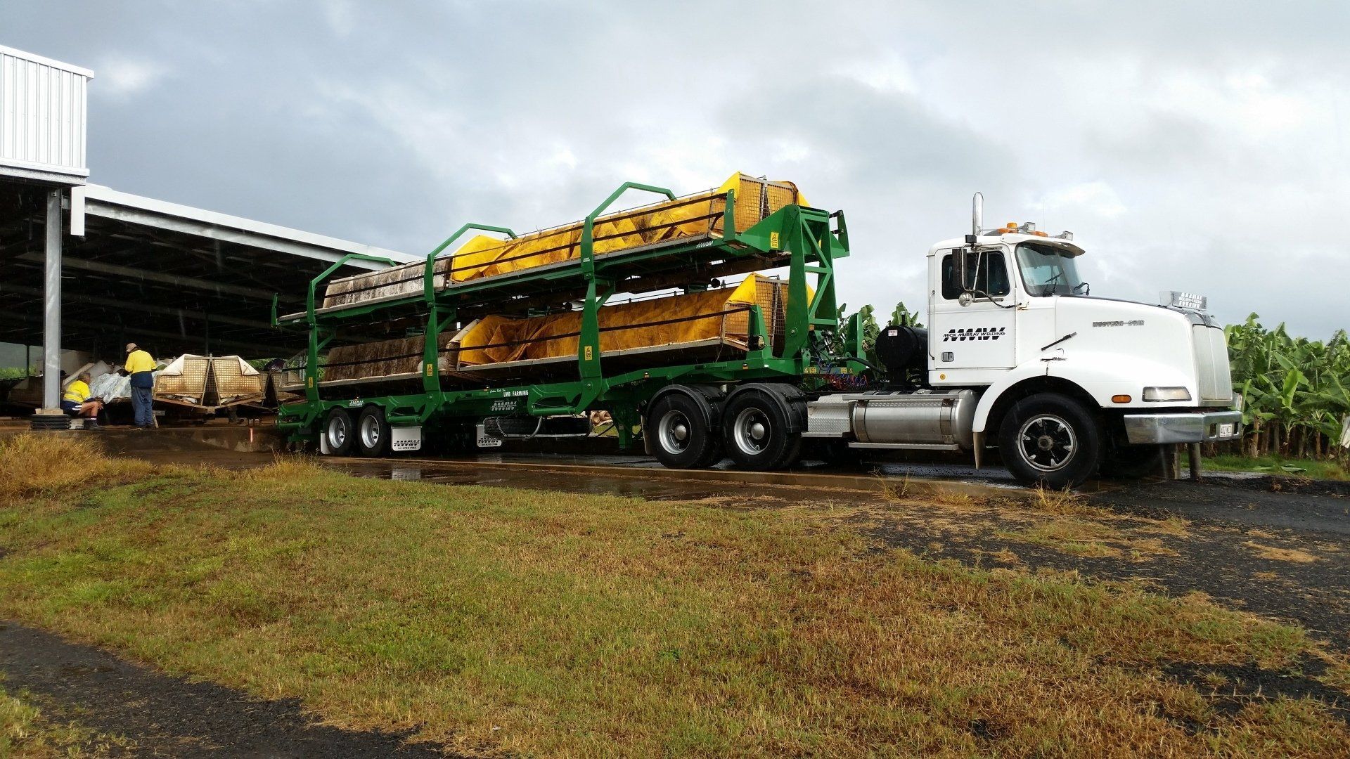 A White Semi-Truck Hauling Large  Machinery — Aust. Advanced Trailer Sales & Service in Berrimah, NT