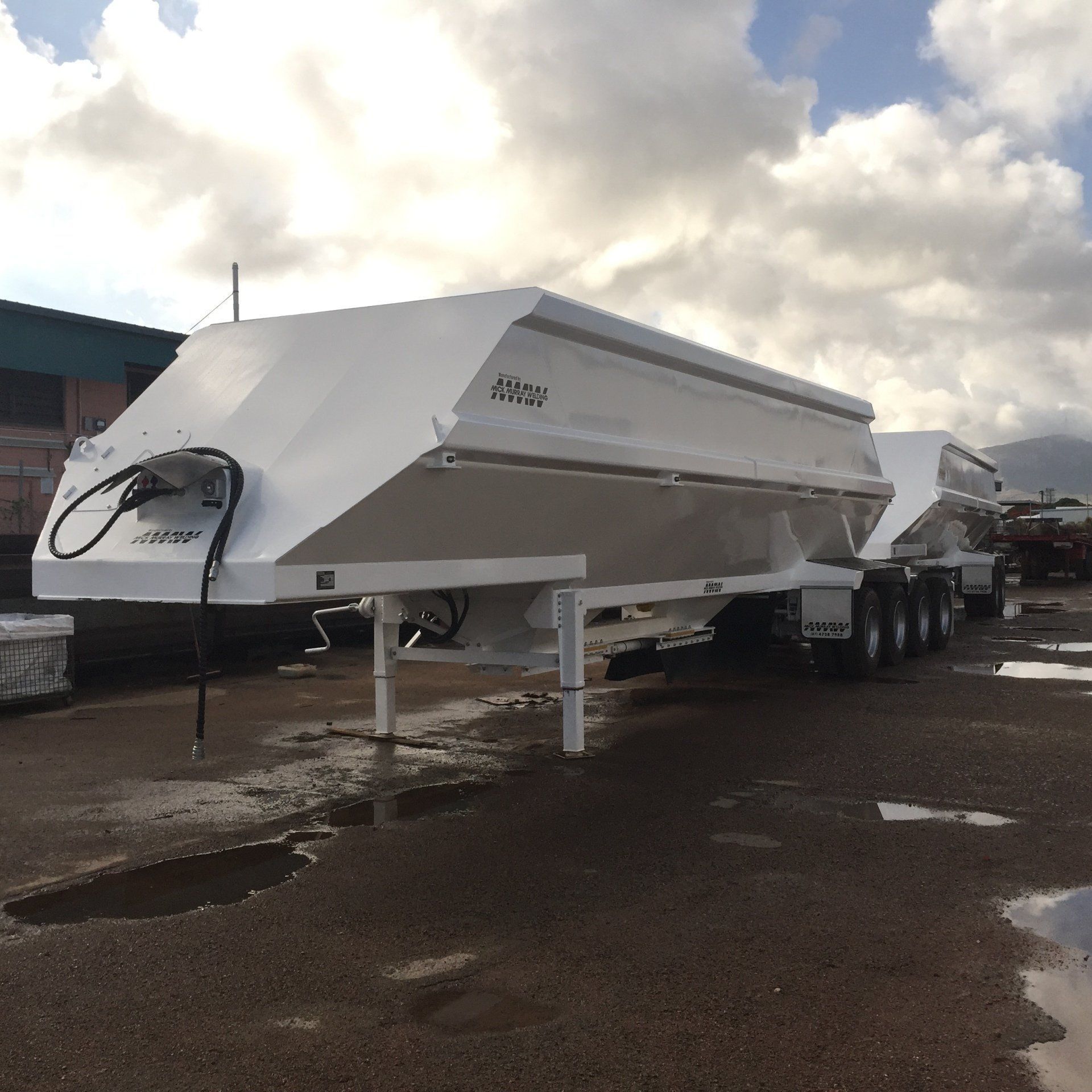 A White Semi-Trailer Parked Outdoors on A Paved Surface — Aust. Advanced Trailer Sales & Service in Berrimah, NT