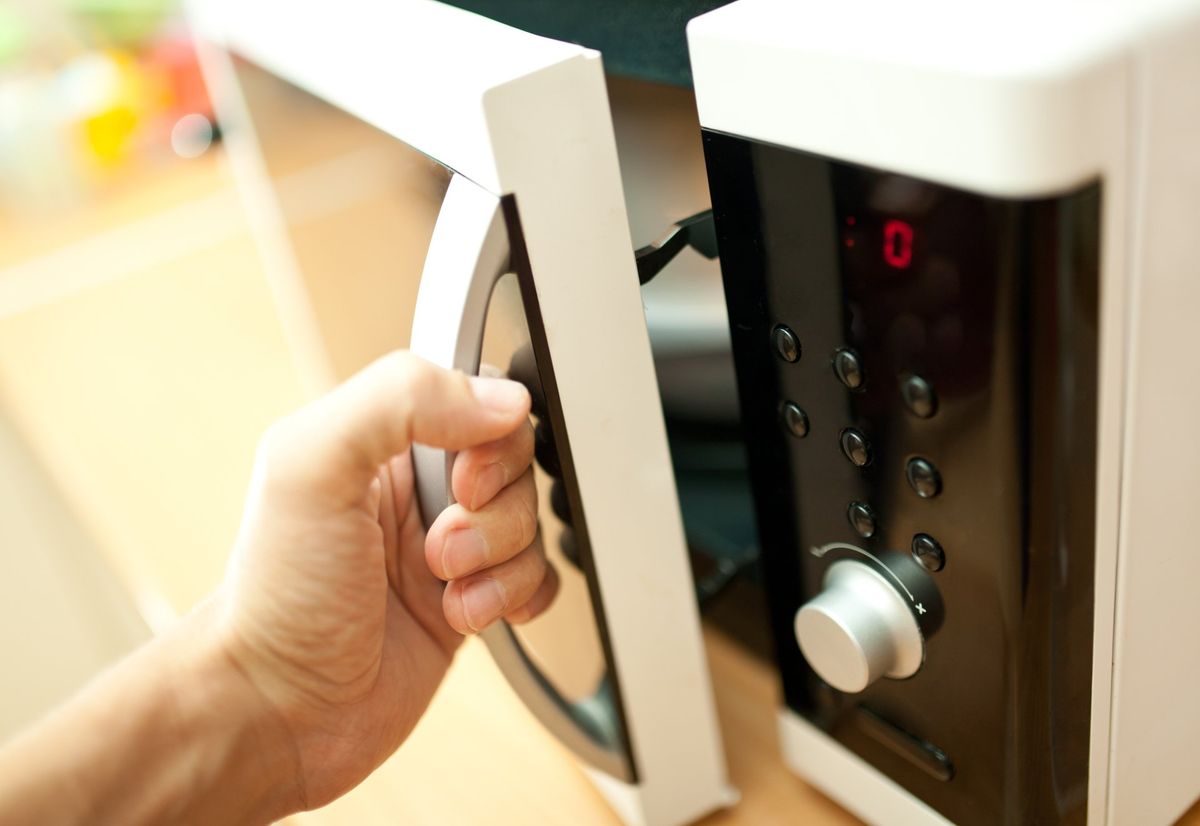 Fix Oven — Hand Holding and Opening Oven in Hampton Roads, VA