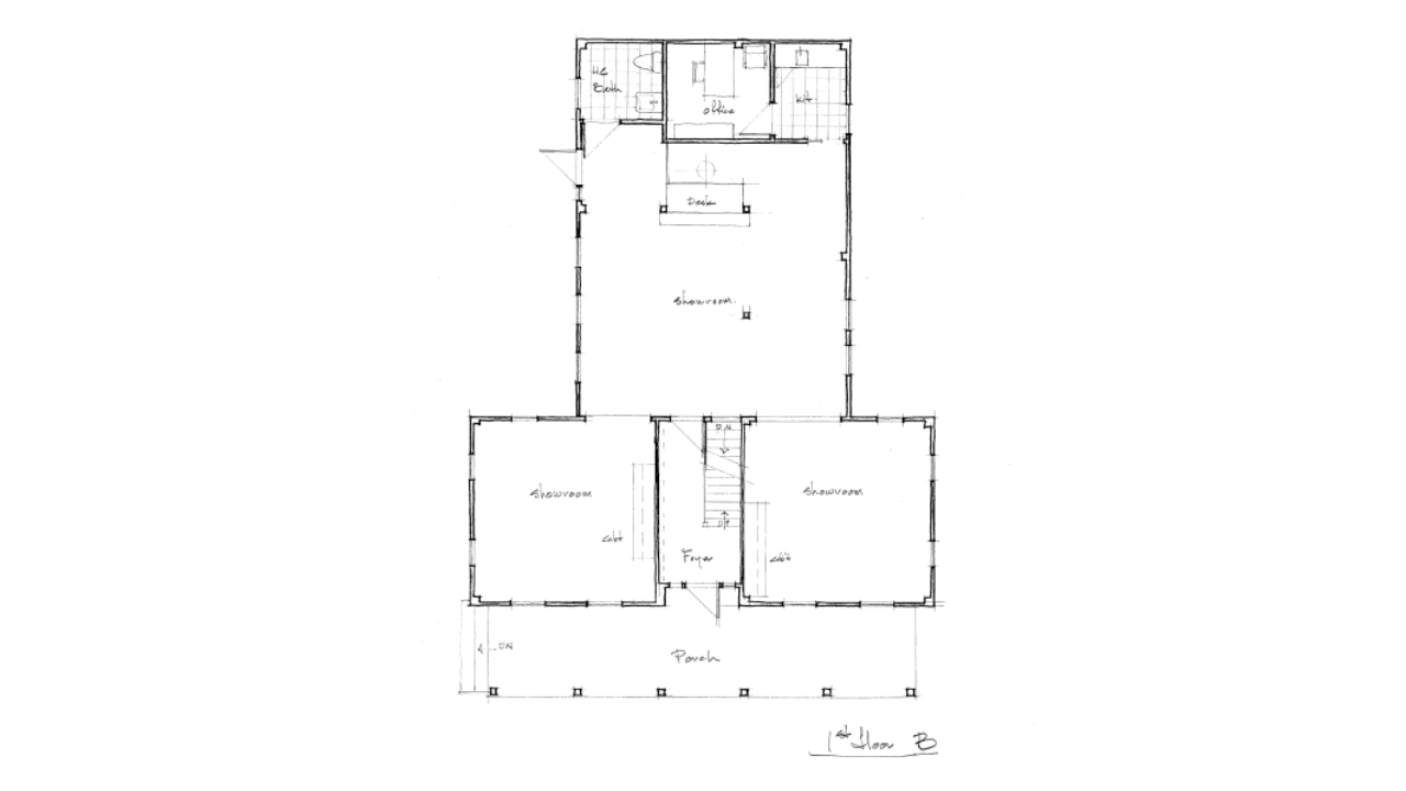 Architectural floor plan of a building with two bottom rooms, a large central room, and top rooms.
