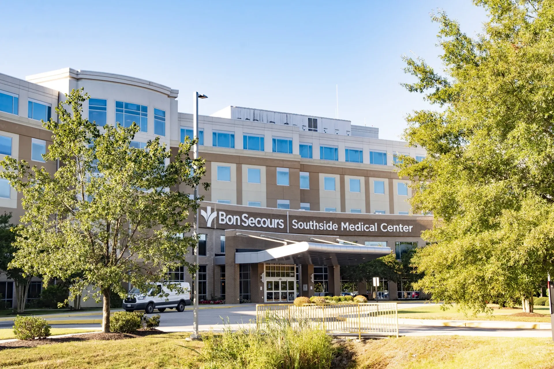 Bon Secours Southside Medical Center, a multi-story, light-colored building with blue windows and a covered entrance.