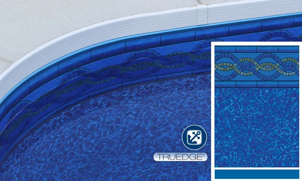 A picture of a swimming pool with a blue tile border