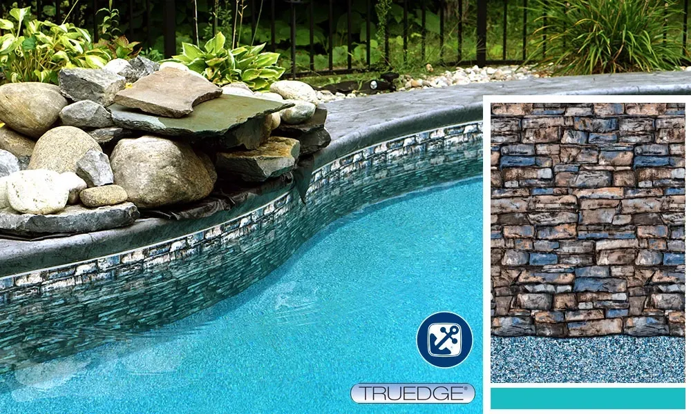 A picture of a swimming pool with a picture of a stone wall behind it.