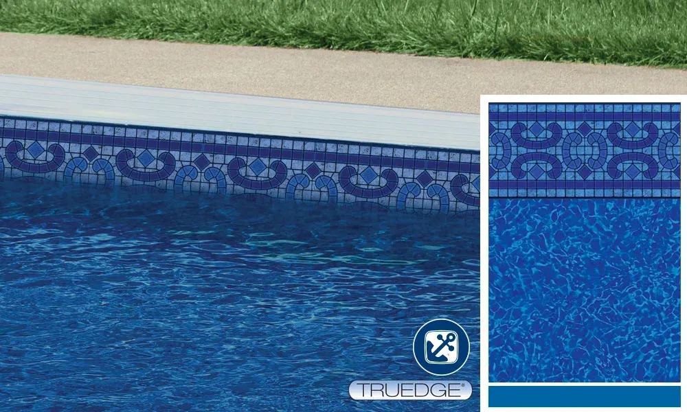 A picture of a swimming pool with a blue tile border