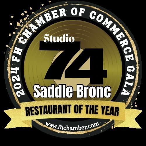 Saddle Bronc Restaurant of the Year 2022 award logo with green, gold, and white elements.