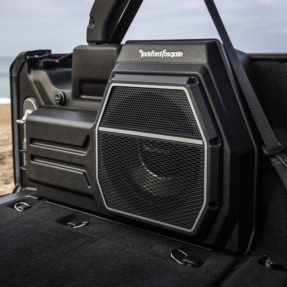 Black Rockford Fosgate speaker enclosure in the rear of a Jeep.