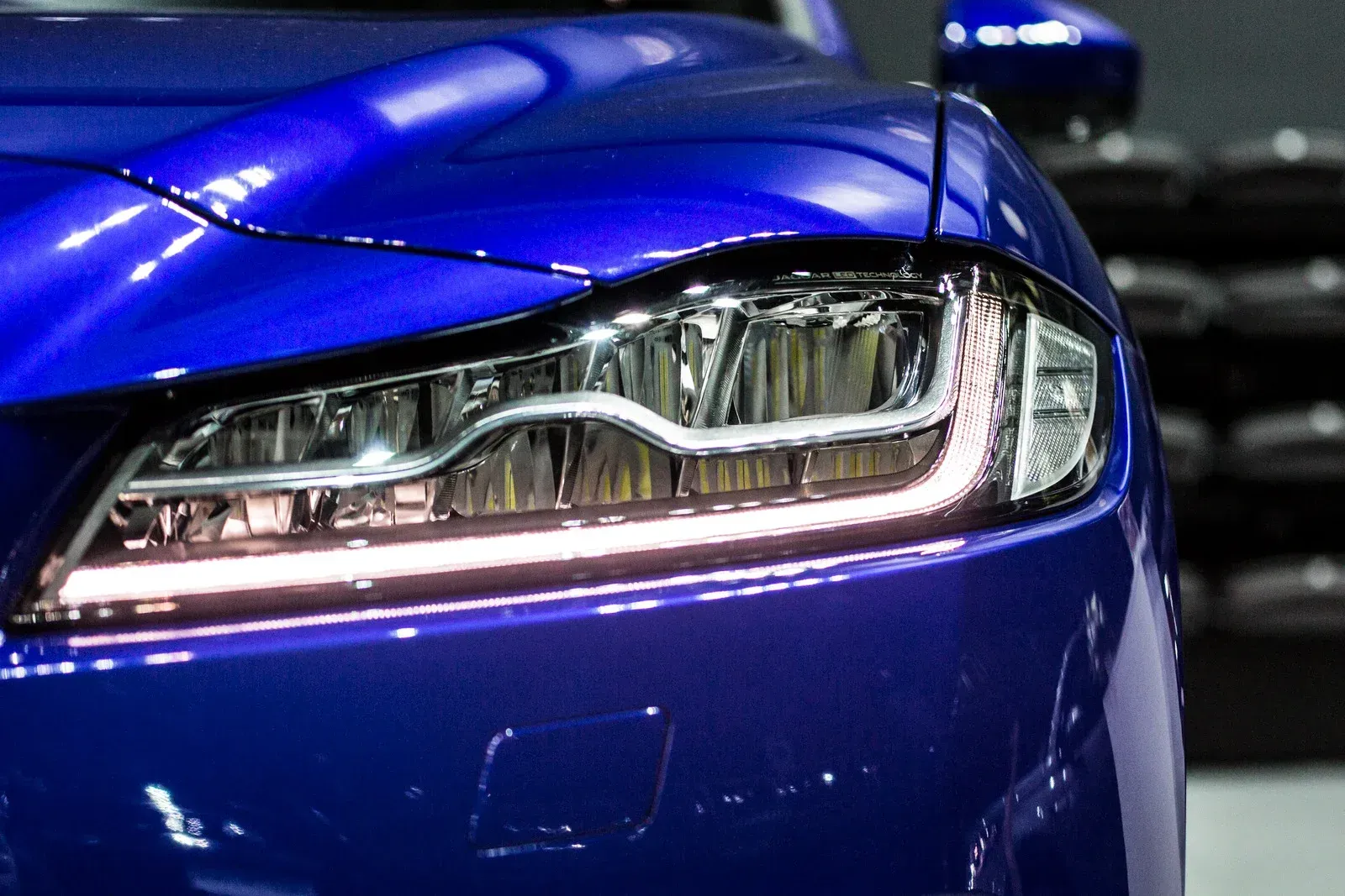 Blue car headlight with LED detail.