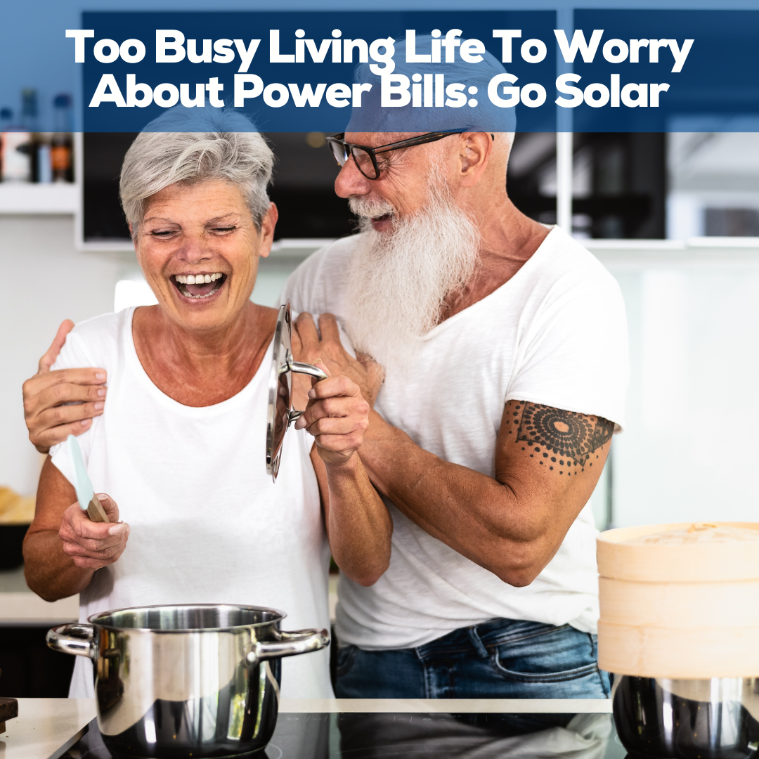 Elderly couple laughing together in the kitchen