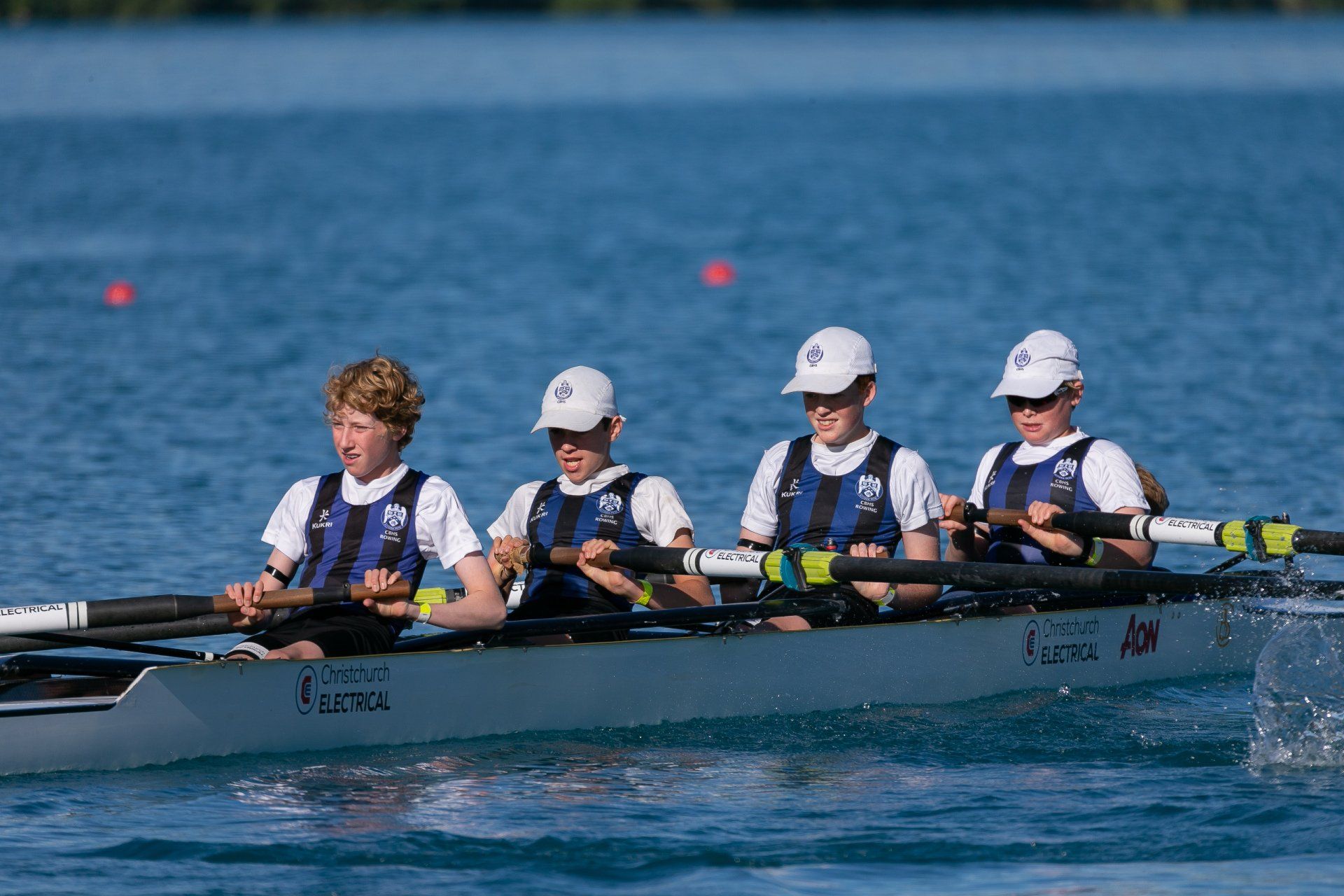 CBHS Rowing Team in Row Boat - Chch Electrical Sponsorship On Boat